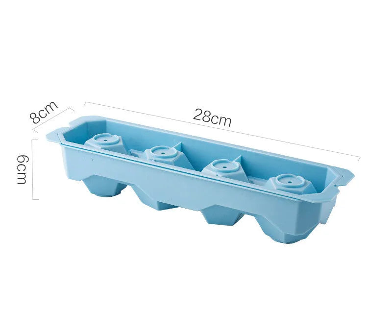 Flexible silicone ice tray producing large hockey puck-shaped ice cubes and other decorative shapes like spheres and pentagons.
