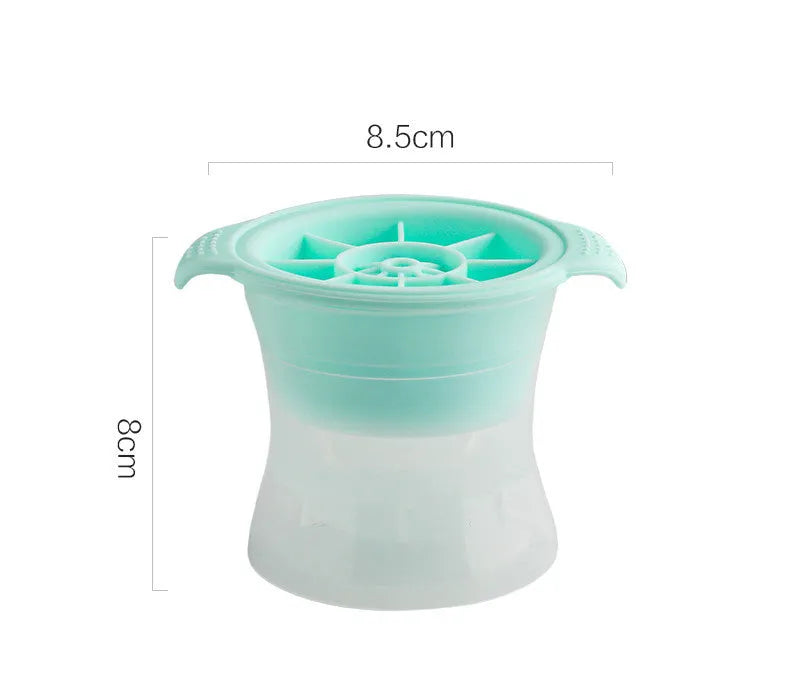 Flexible silicone ice tray producing large hockey puck-shaped ice cubes and other decorative shapes like spheres and pentagons.