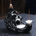 Ceramic backflow incense burner with black glaze finish and waterfall smoke effect