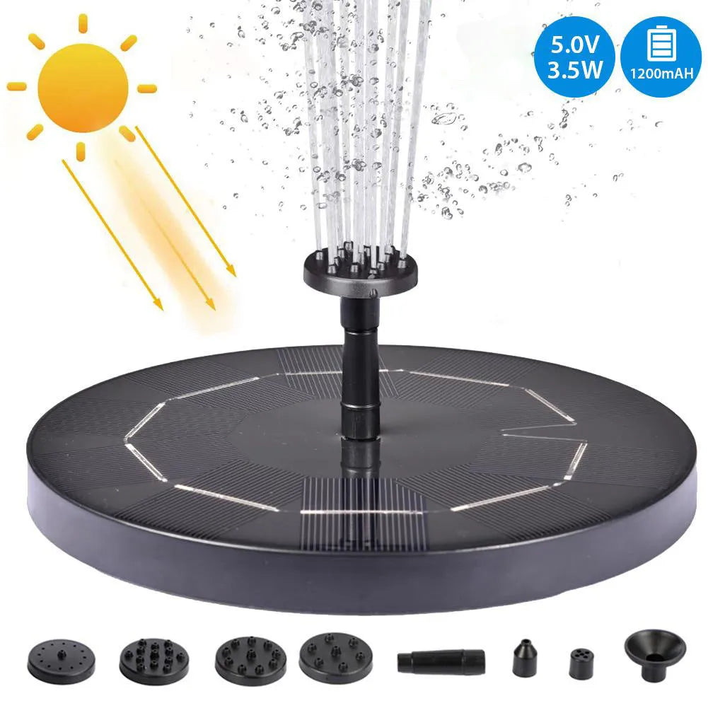 Black solar garden fountain pump with panel and four spray nozzles on grass
