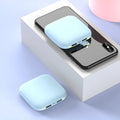 Compact square black power bank with 20000mAh capacity and a small LED flashlight on the front.