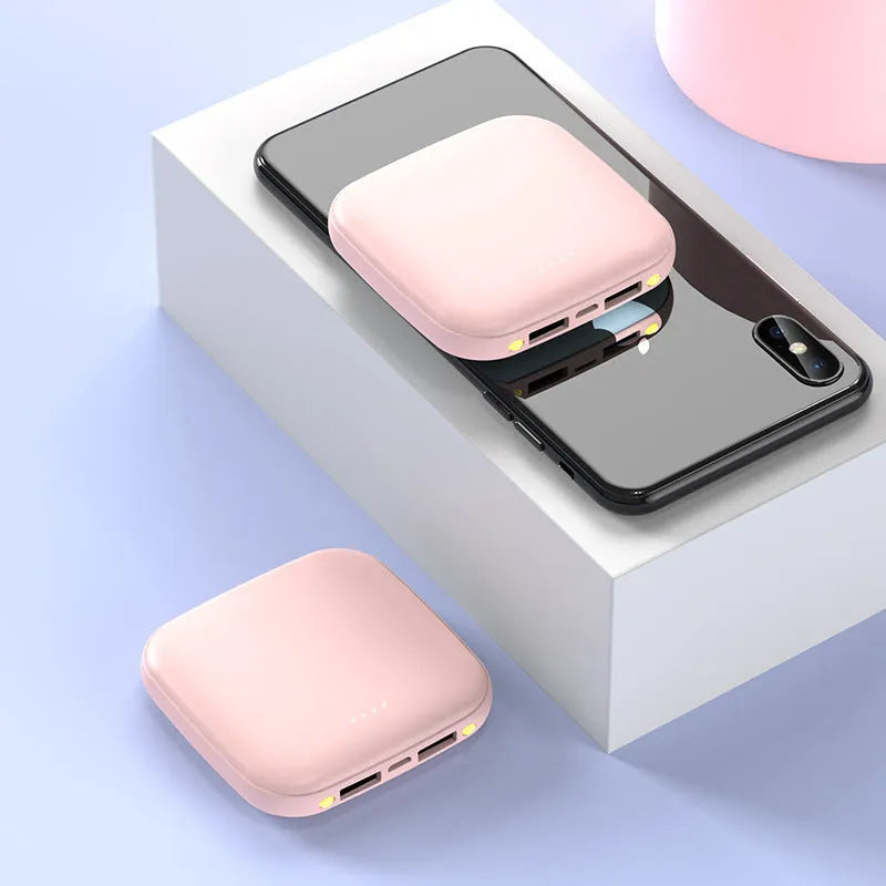 Compact square black power bank with 20000mAh capacity and a small LED flashlight on the front.