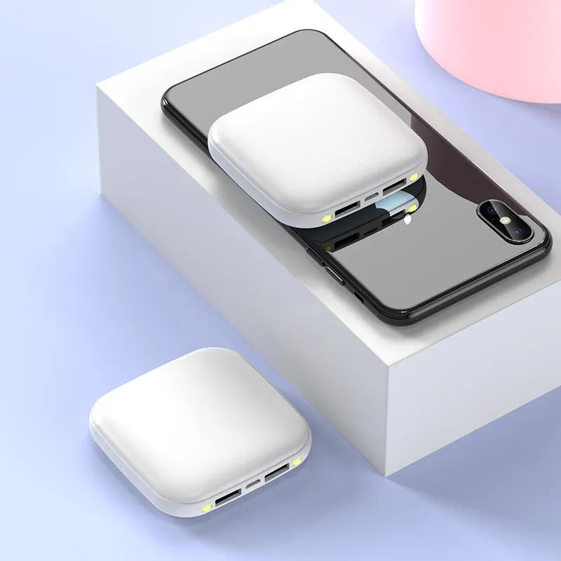 Compact square black power bank with 20000mAh capacity and a small LED flashlight on the front.