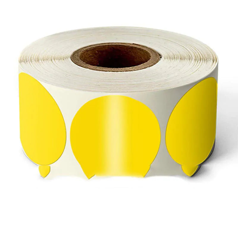 Roll of round colour marker stickers showing multiple colours including black, blue, red, yellow, and kraft paper.