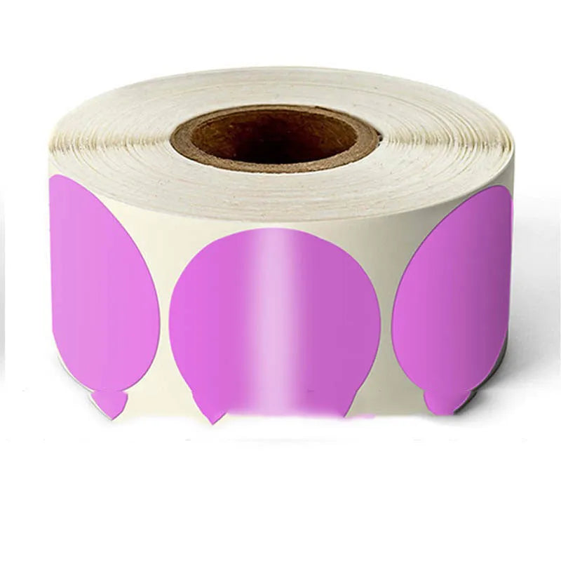 Roll of round colour marker stickers showing multiple colours including black, blue, red, yellow, and kraft paper.