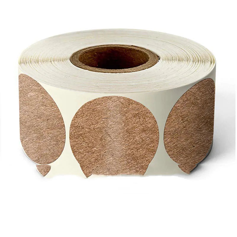 Roll of round colour marker stickers showing multiple colours including black, blue, red, yellow, and kraft paper.