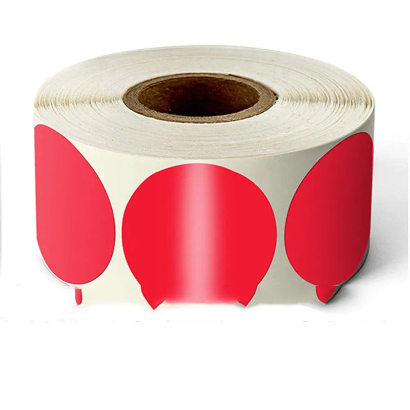 Roll of round colour marker stickers showing multiple colours including black, blue, red, yellow, and kraft paper.