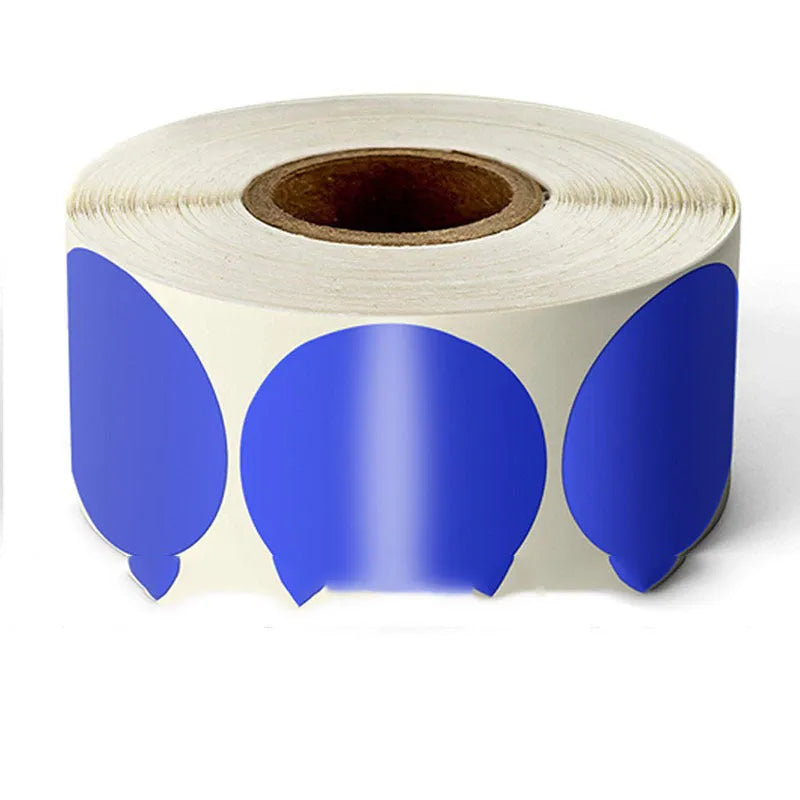 Roll of round colour marker stickers showing multiple colours including black, blue, red, yellow, and kraft paper.