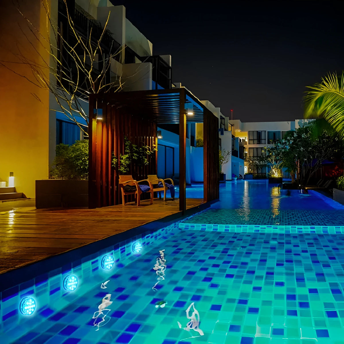 13 LED IP68 submersible underwater light with suction cup and RF remote, showing 16 colours in a swimming pool
