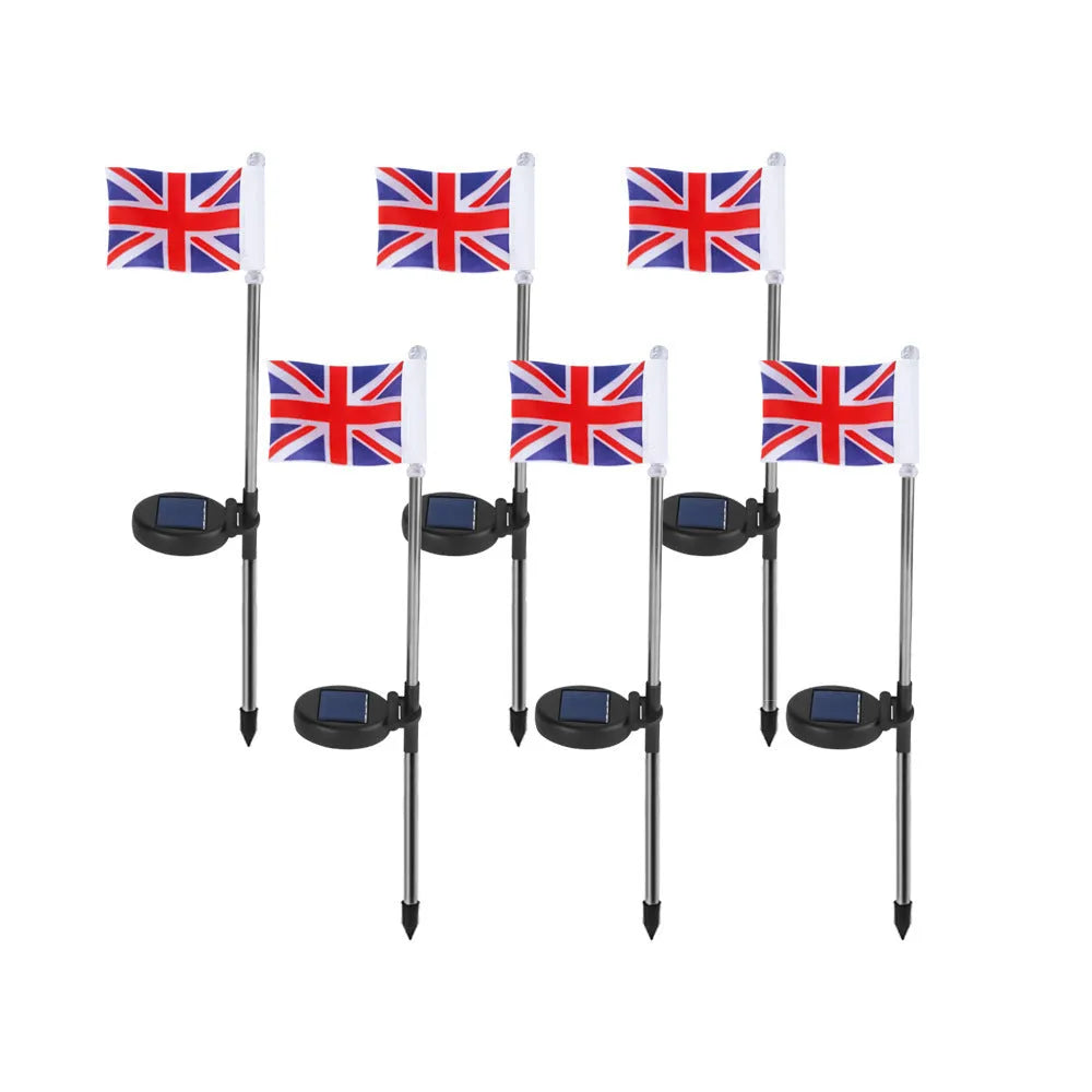 Solar-powered stainless steel garden flag light showing American flag design with white LEDs illuminated.