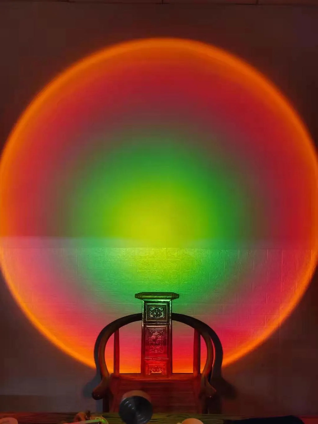 WiFi LED sunset projector light with 16 RGB colours, 360° rotation, glass lampshade, and touch switch on a table