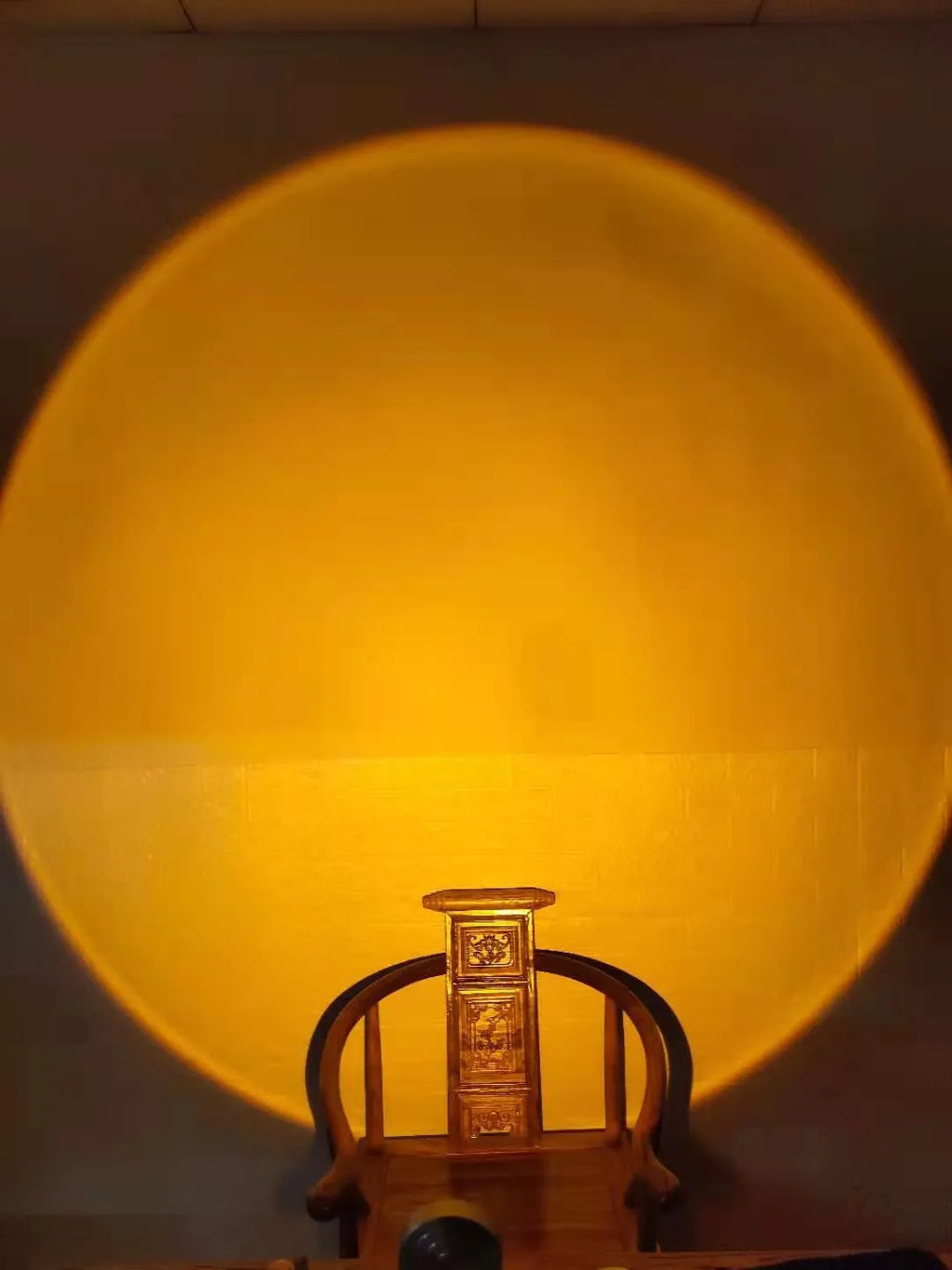 WiFi LED sunset projector light with 16 RGB colours, 360° rotation, glass lampshade, and touch switch on a table