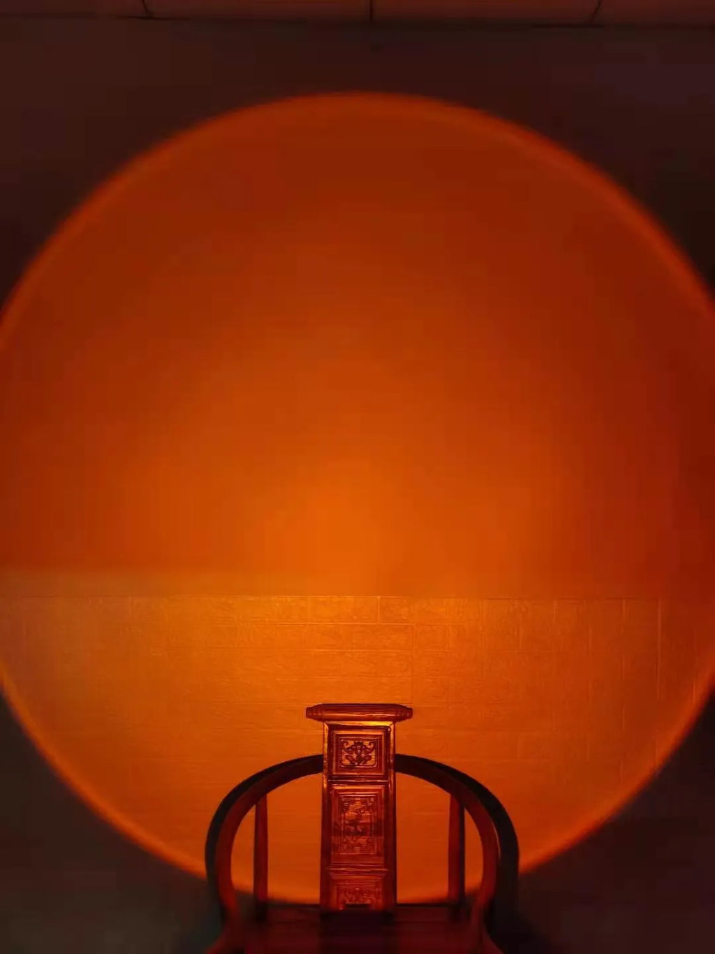 WiFi LED sunset projector light with 16 RGB colours, 360° rotation, glass lampshade, and touch switch on a table