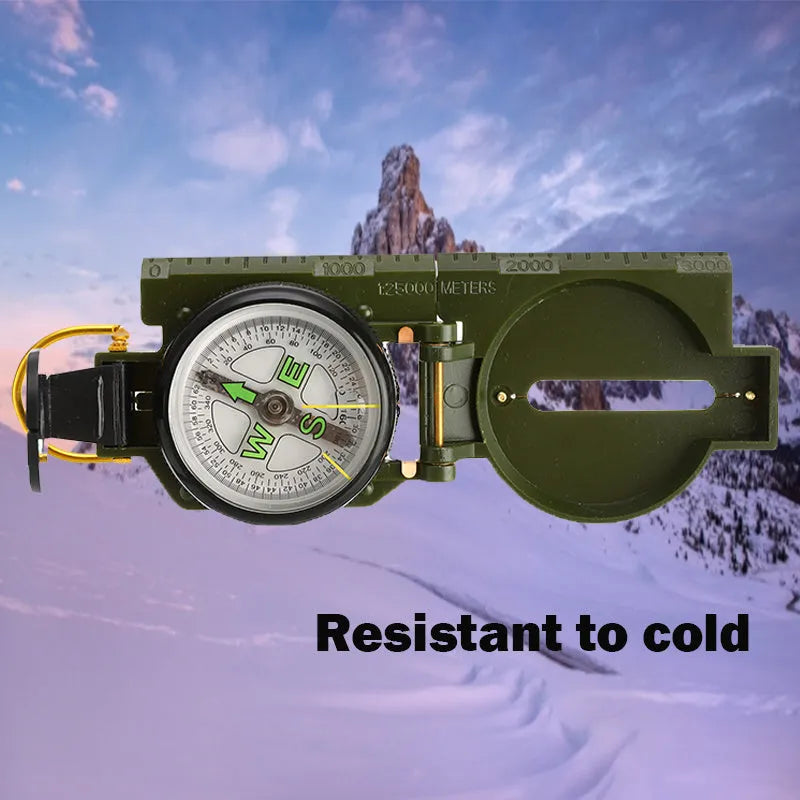 Army yellow outdoor camping compass with carabiner clip on a metal background
