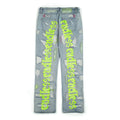 Ripped retro jeans trousers for men and women, straight loose fit, black, with embroidery and frayed details on a model standing outdoors