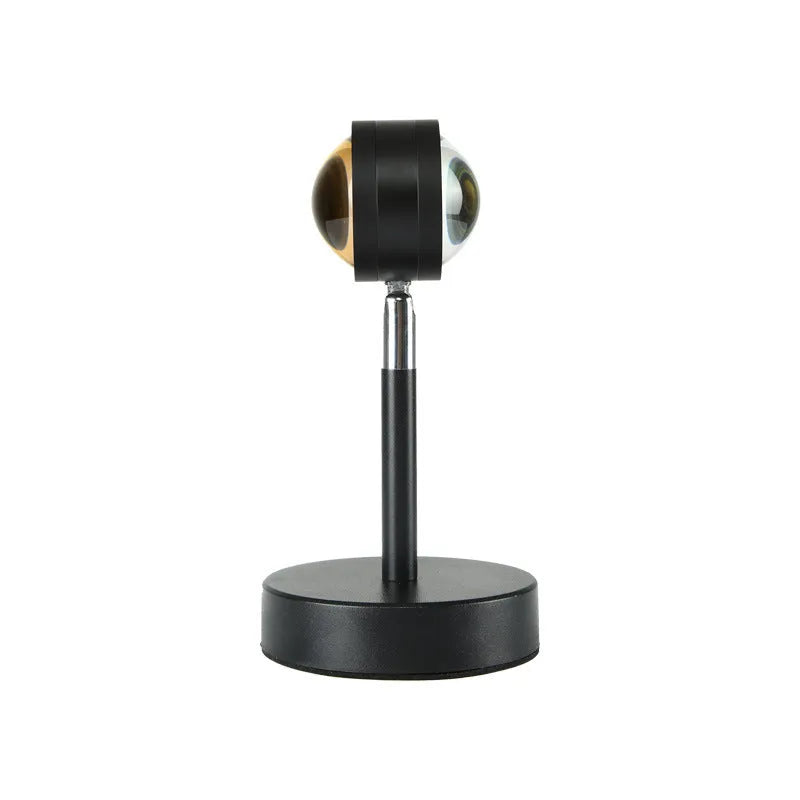 Black USB dual-head sunset rainbow projection lamp with touch control on a table.