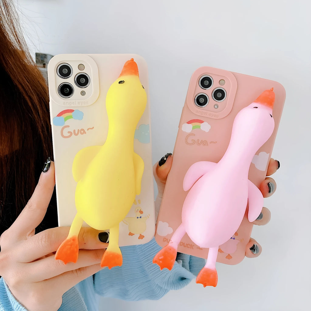Pinch duck cartoon print silicone protective case for iPhone in yellow, white, or pink.