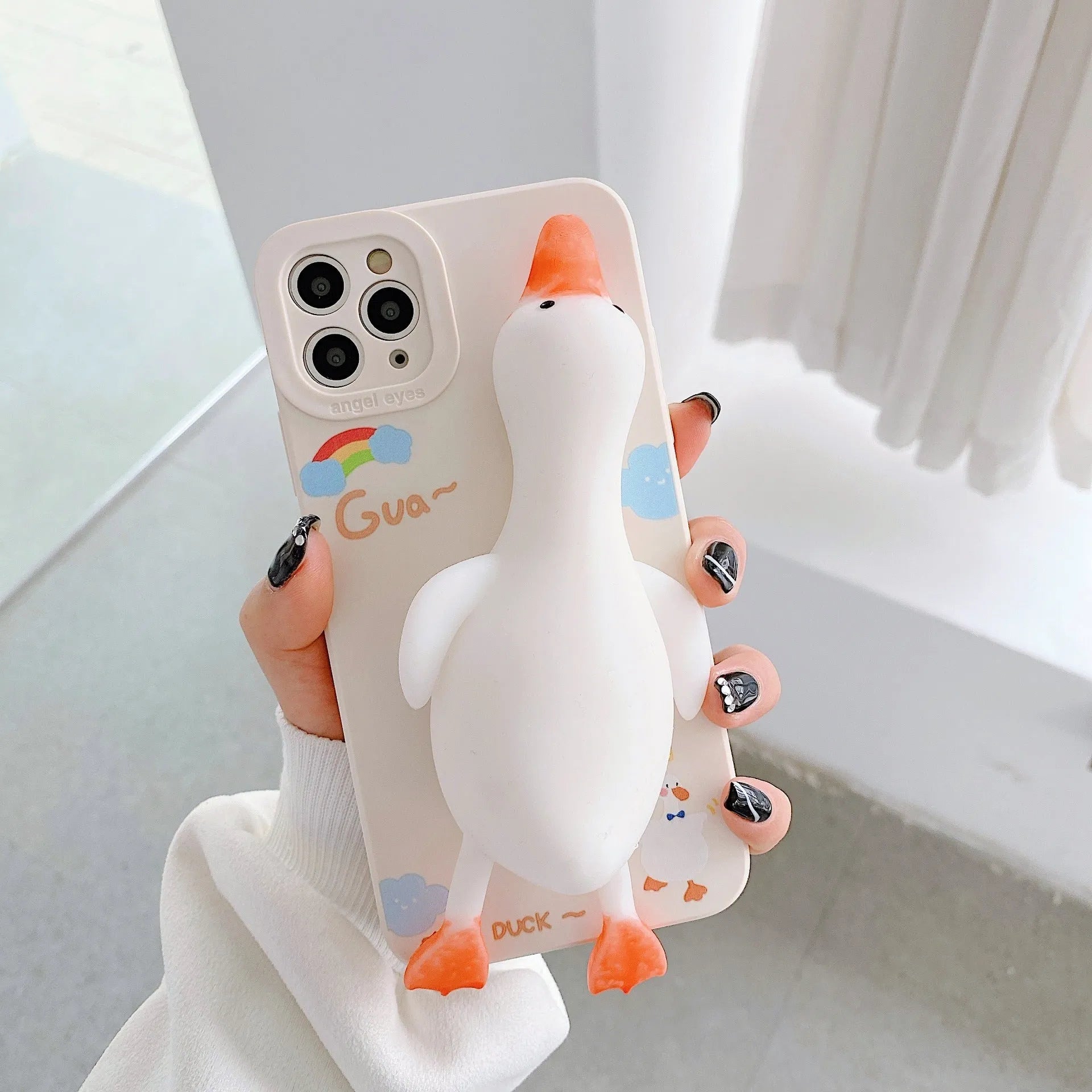 Pinch duck cartoon print silicone protective case for iPhone in yellow, white, or pink.