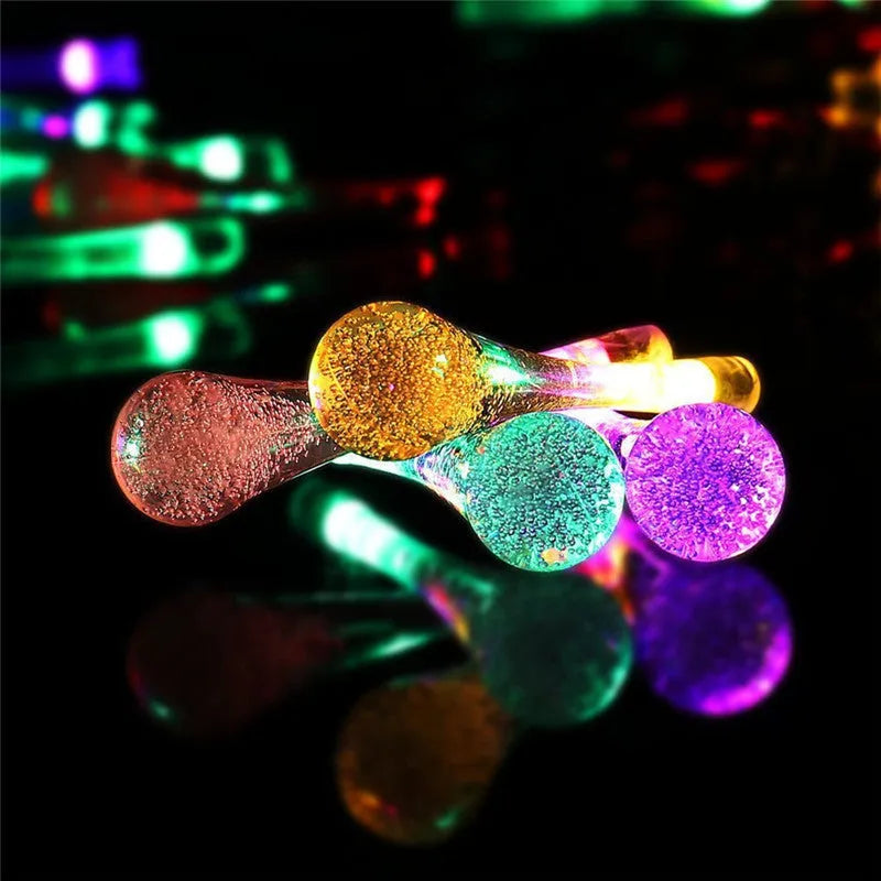 Solar-powered LED outdoor string lights with water drop-shaped pendants on a 6.5m cable