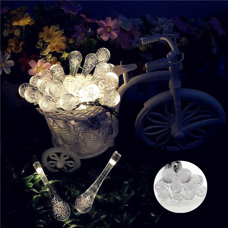 Solar-powered LED outdoor string lights with water drop-shaped pendants on a 6.5m cable