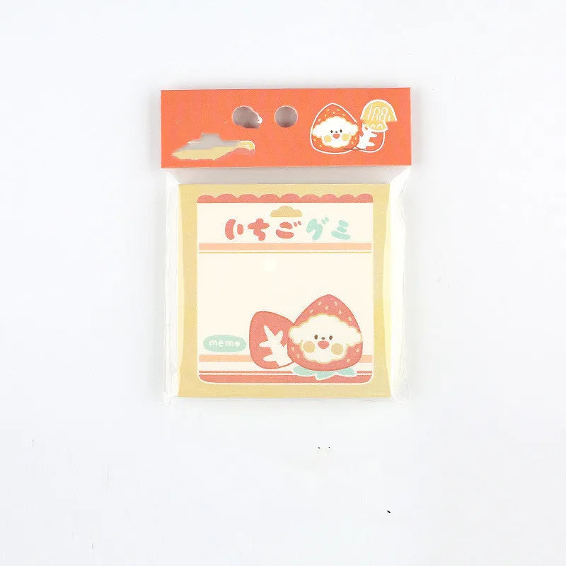 Minky's Kawaii square memo notepad in a strawberry pattern, showing its 80x80mm size and paper brick shape.