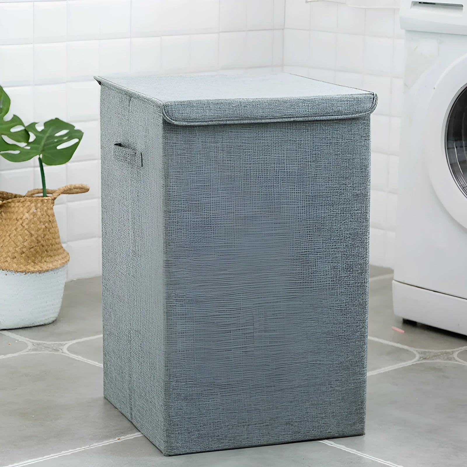 Washable fabric clothes sorting box with cover in beige, shown in a bathroom setting.