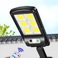 IP67 waterproof solar wall light with high-brightness 120COB LED, black plastic housing, mounted on an outdoor wall