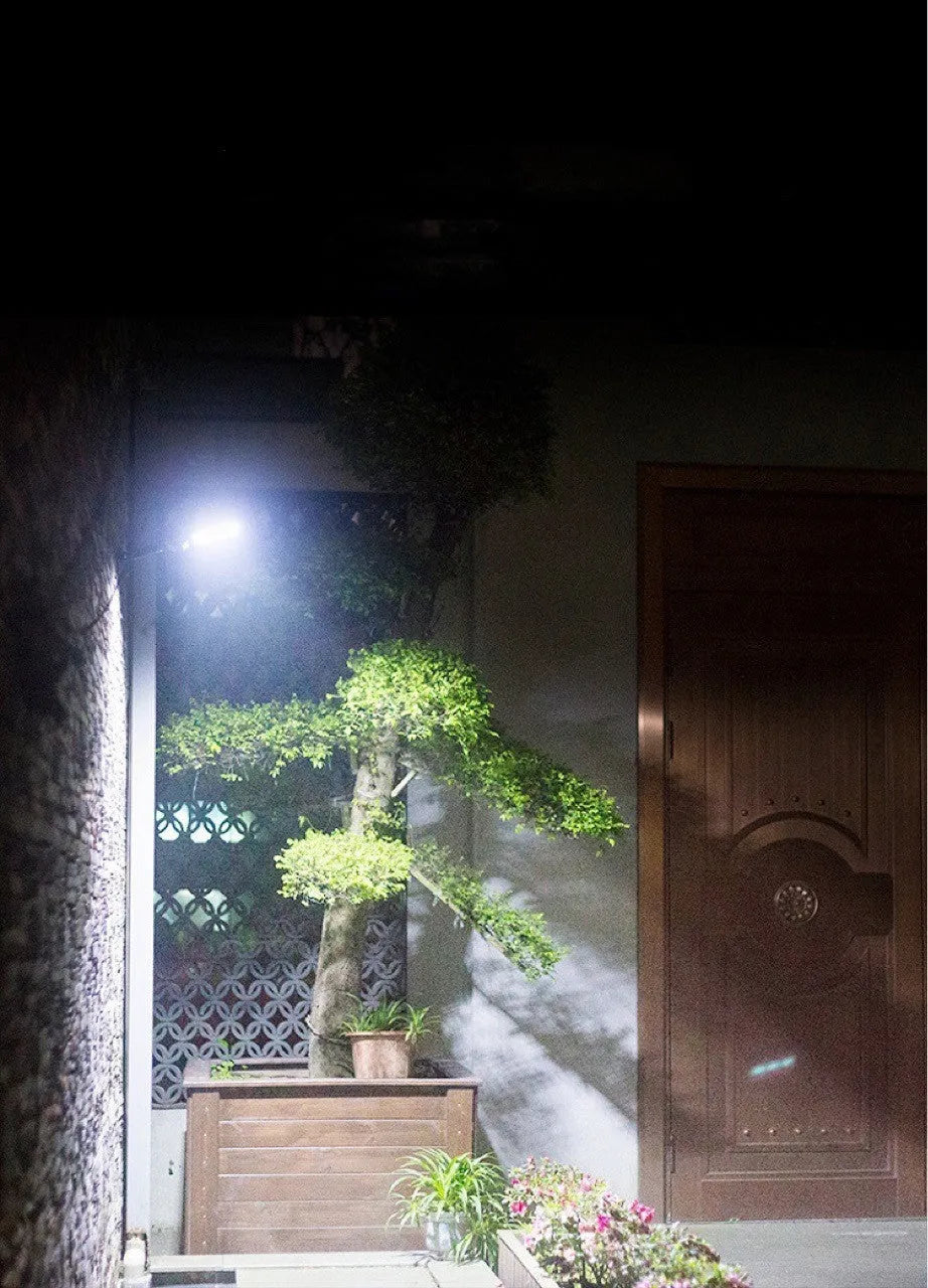 IP67 waterproof solar wall light with high-brightness 120COB LED, black plastic housing, mounted on an outdoor wall