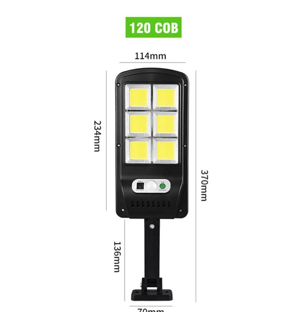 IP67 waterproof solar wall light with high-brightness 120COB LED, black plastic housing, mounted on an outdoor wall