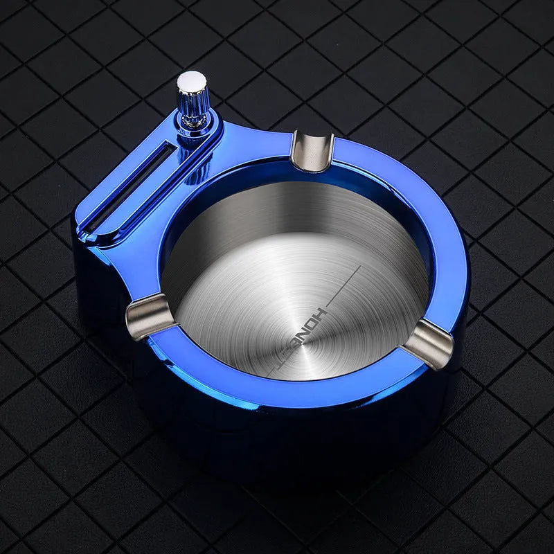 Large blue metal ashtray with integrated permanent match lighter and three cigarette slots.