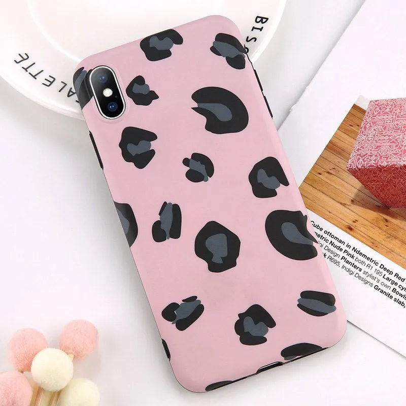 Leopard print mobile phone case for iPhone in black, blue, and pink colours