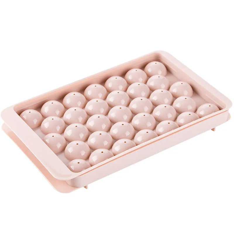 Sky blue or pink plastic ice cube tray making round ball ice for drinks.