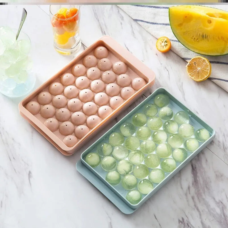 Sky blue or pink plastic ice cube tray making round ball ice for drinks.