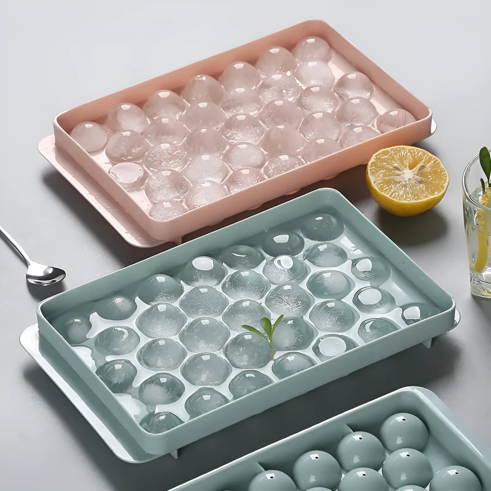 Sky blue or pink plastic ice cube tray making round ball ice for drinks.