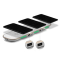 Black and white 3-in-1 Qi wireless charging pad station on a wooden desk.