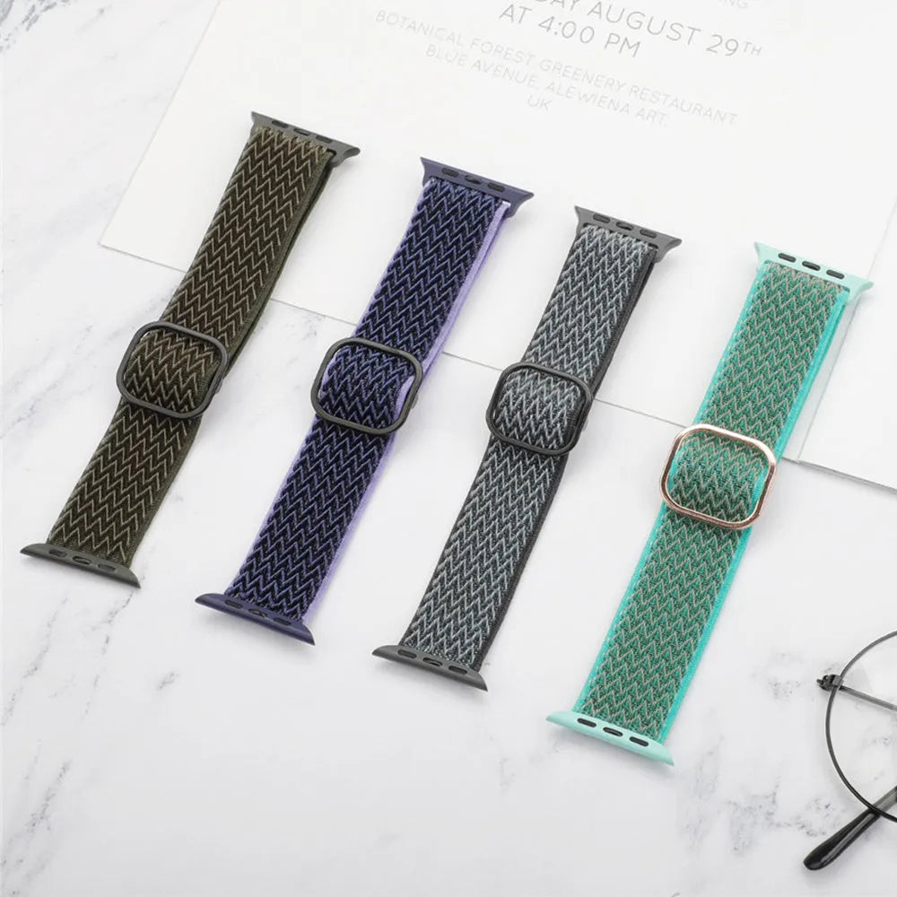 Braided nylon elastic strap for Apple Watch in various colours on a grey background.