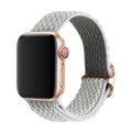 Braided nylon elastic strap for Apple Watch in various colours on a grey background.