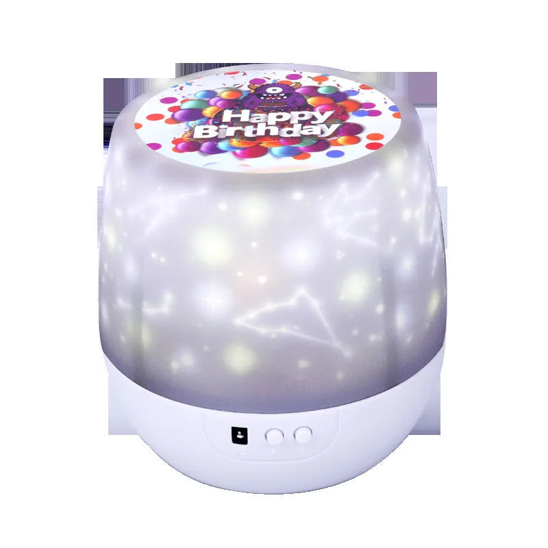Compact plastic starry sky projector showing cosmic projection on a wall with USB cable.