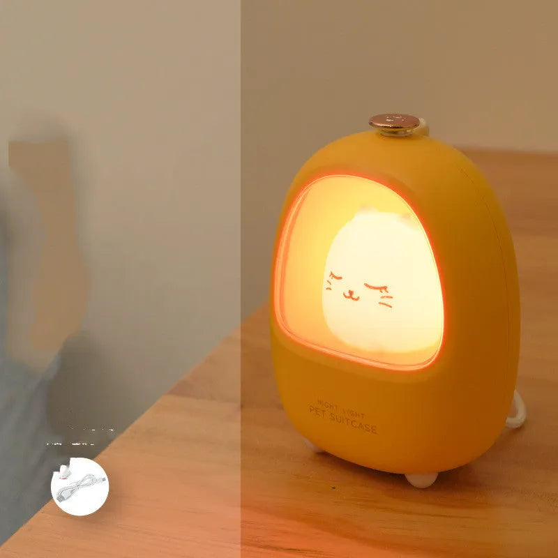 Cartoon character night light on bedside table with USB charging cable
