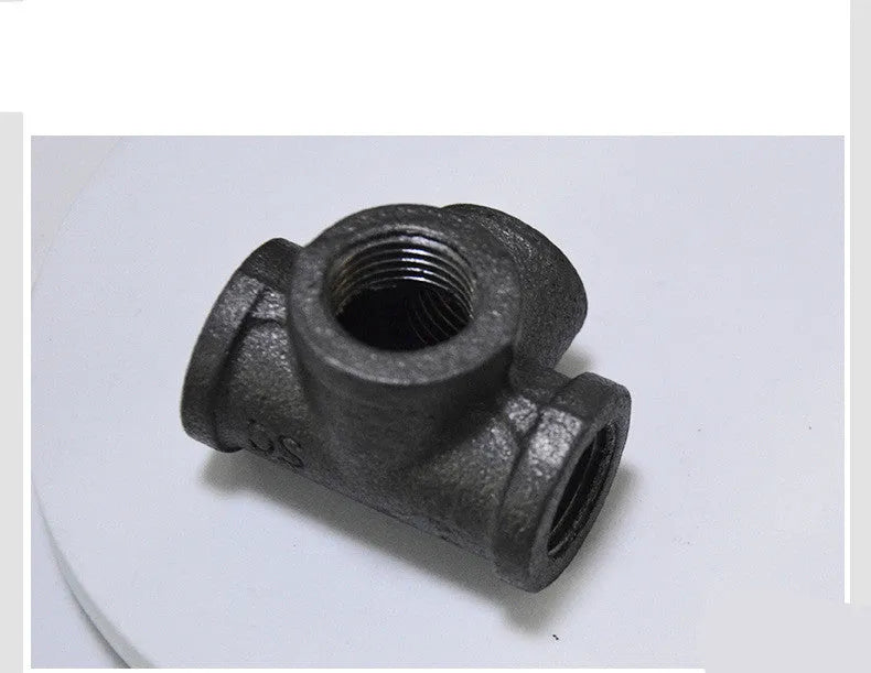 Galvanised steel four-way pipe fittings in three diameter sizes with malleable iron construction