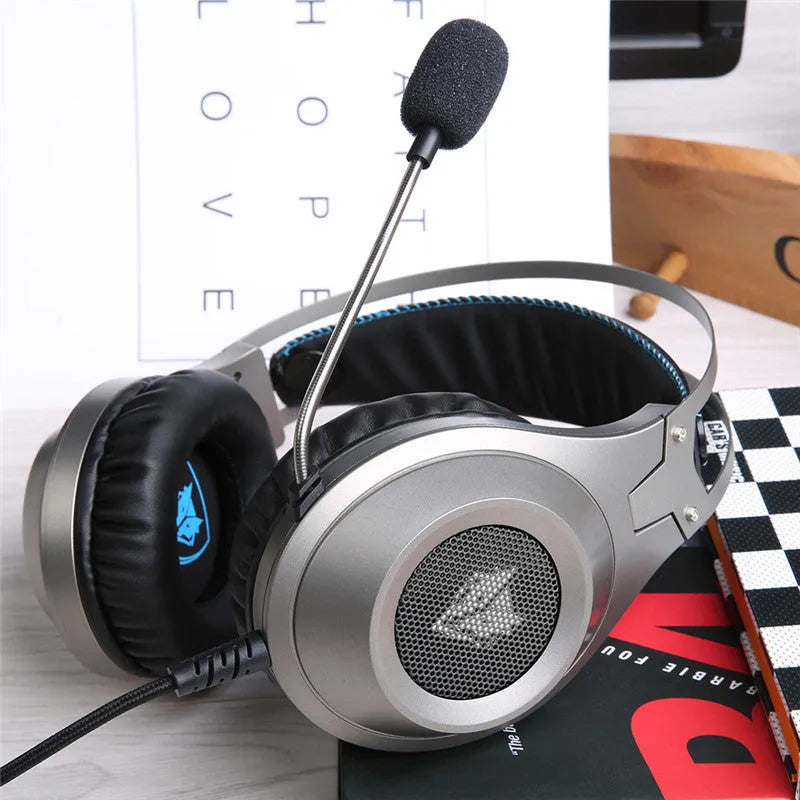 Black wired USB over-ear computer headset with microphone on a desktop.