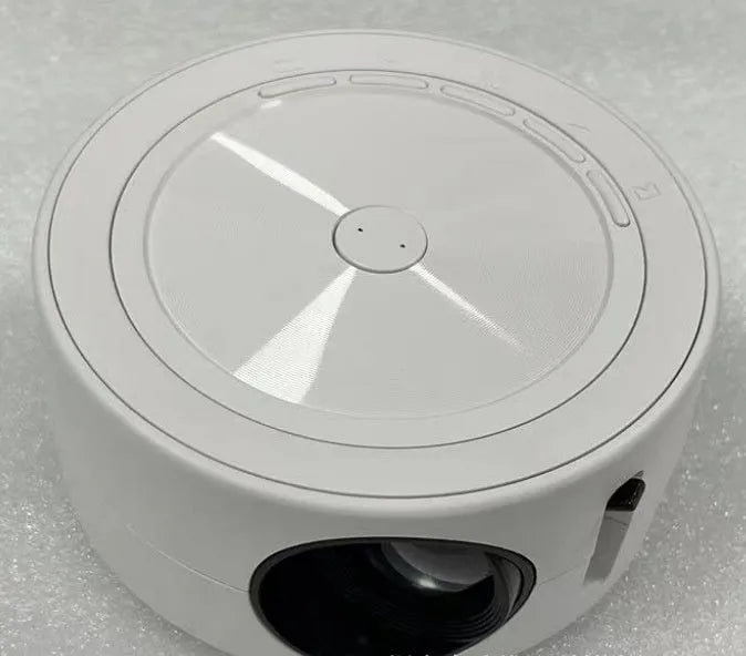 YT200 portable LED projector in four colour options showing 110mm diameter compact design