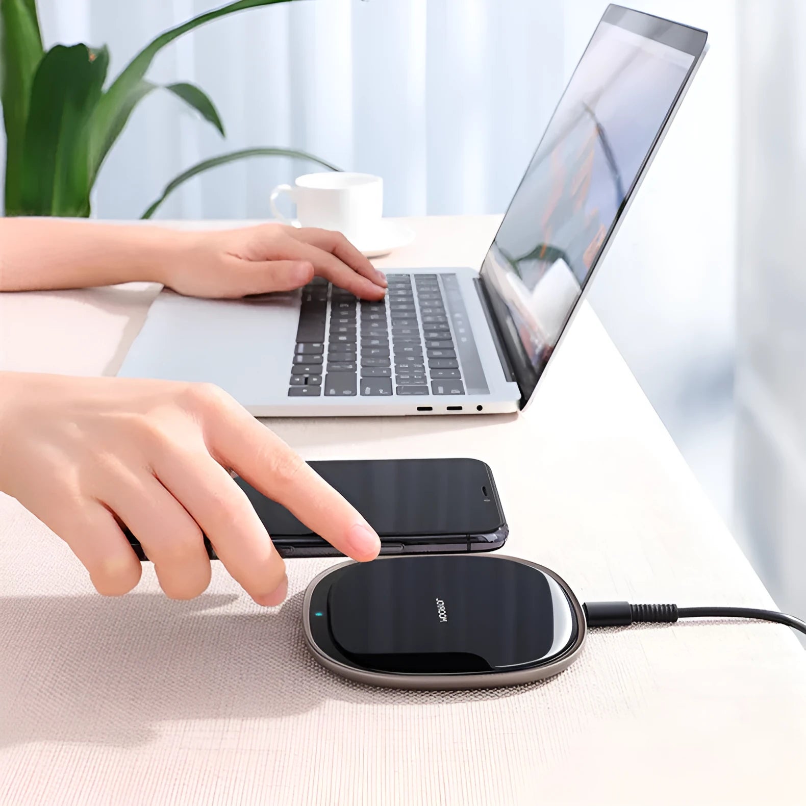 Black or white 15W wireless phone charger with zinc alloy and glass build on a desk