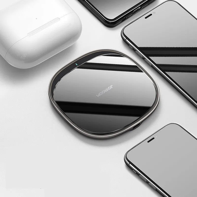 Black or white 15W wireless phone charger with zinc alloy and glass build on a desk