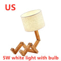 Creative wooden humanoid table lamp with white fabric shade, deformable design, 22x44x16cm