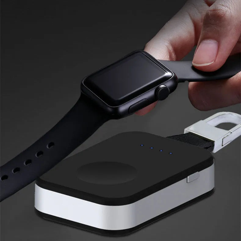 Black Apple Watch wireless keychain power bank on a keyring showing its compact size.