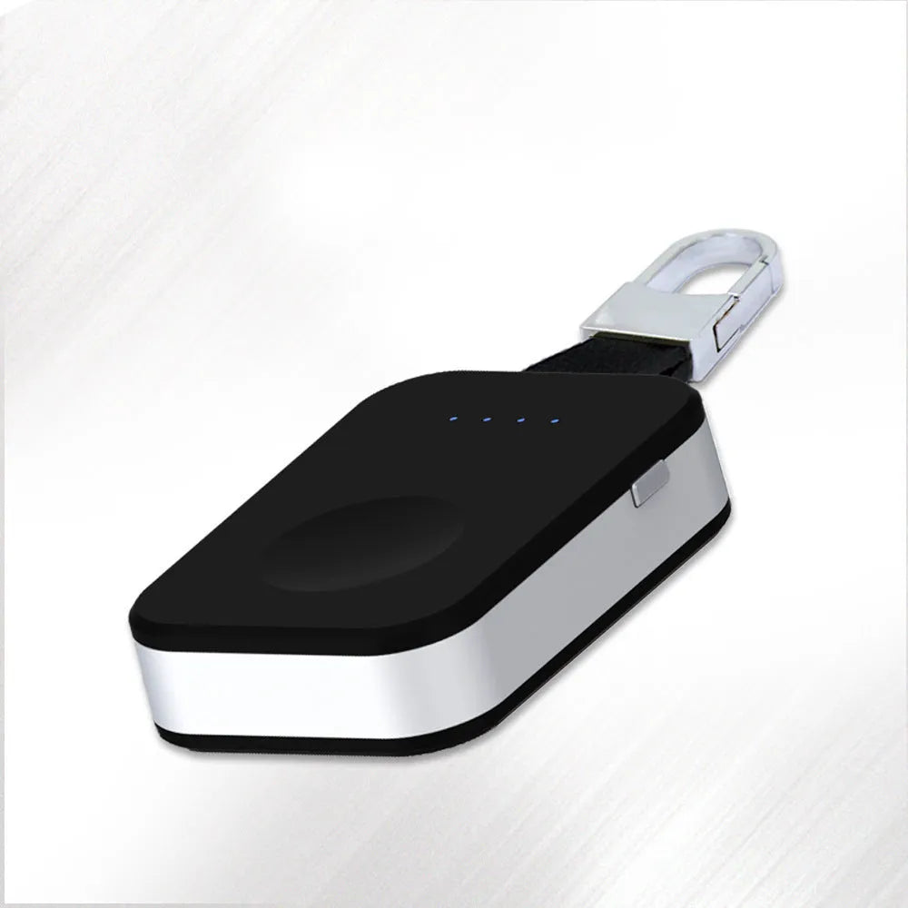 Black Apple Watch wireless keychain power bank on a keyring showing its compact size.
