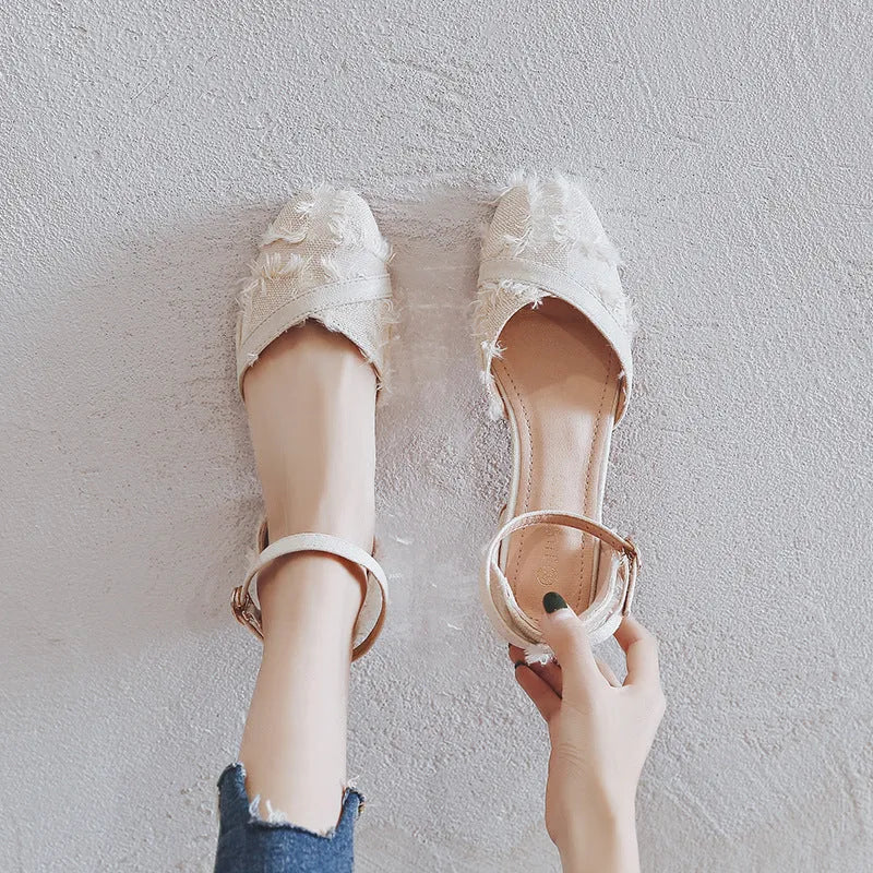 Women's apricot suede D'Orsay flat shoes with an ankle strap and a low heel.