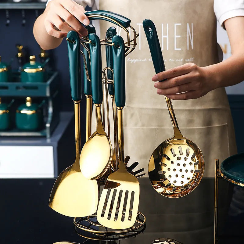 Seven-piece stainless steel kitchen utensil set including slotted spatula, turner, ladle, spoon, and pasta server.