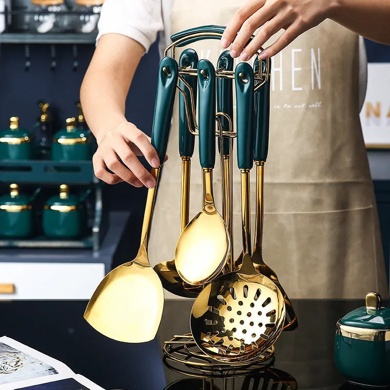 Seven-piece stainless steel kitchen utensil set including slotted spatula, turner, ladle, spoon, and pasta server.